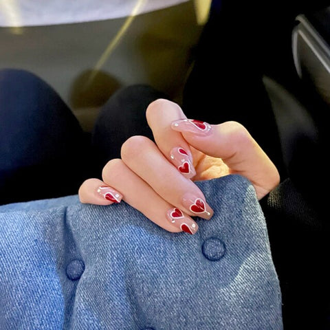 Middle length false nails with heart pattern Inpluser