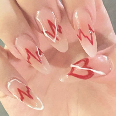 Middle length false nails with heart pattern Inpluser