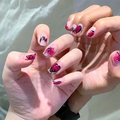Middle length false nails with heart pattern Inpluser